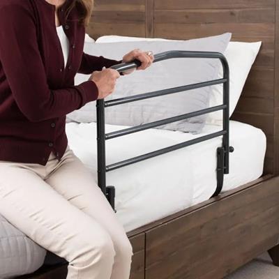bed rail with a woman using it
